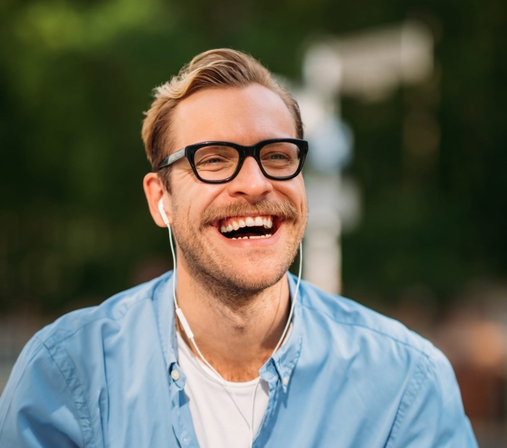We value all our visitors a man smiling outdoors